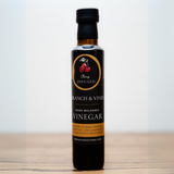 Black Cherry Balsamic Vinegar bottle on a crisp white background, highlighting its elegant design and deep, rich color.