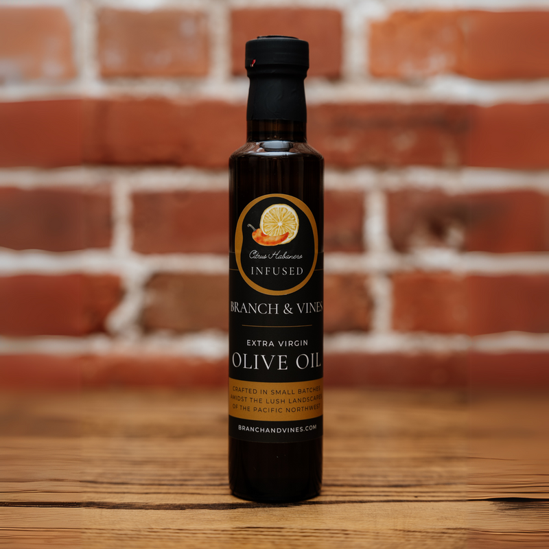 Citrus Habanero Infused Olive Oil bottle against a rustic brick backdrop.