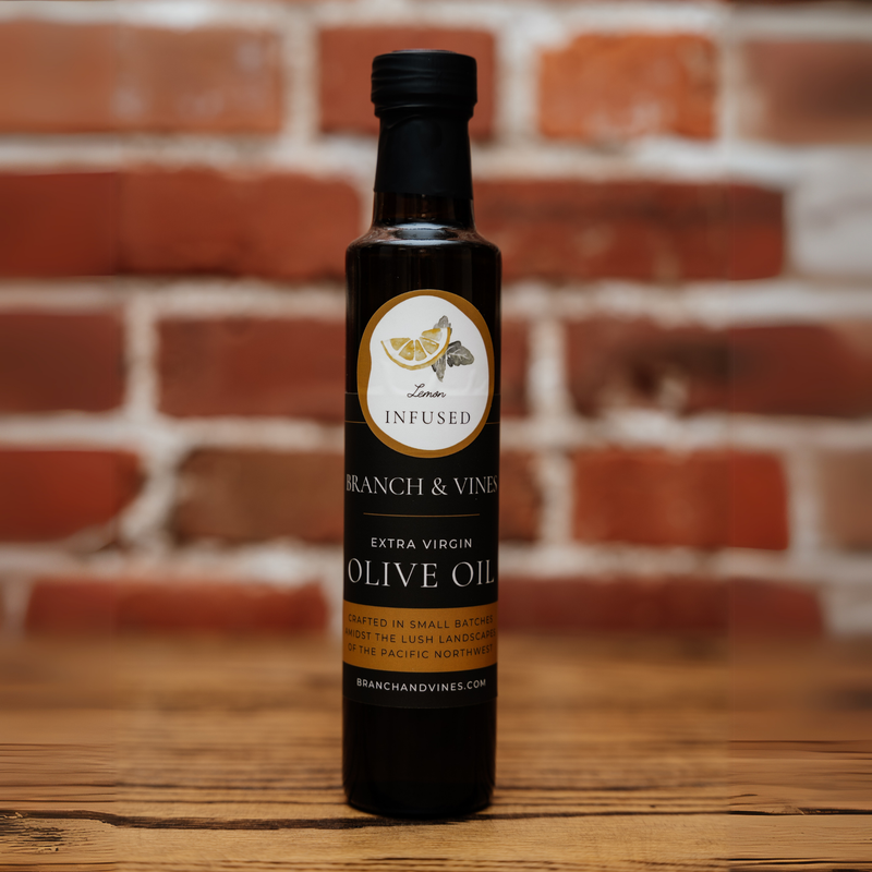 Meyer Lemon Infused Olive Oil bottle against a rustic brick backdrop.